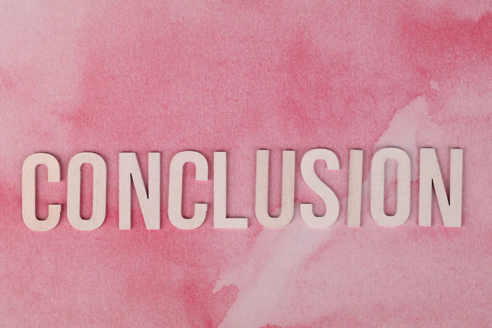 conclusion sign on pink background